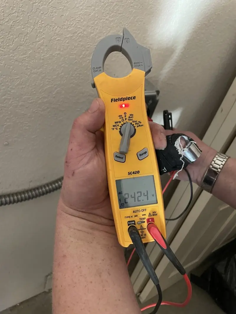 Voltage testing with clamp meter during Ceiling Fan Installation in Arundel